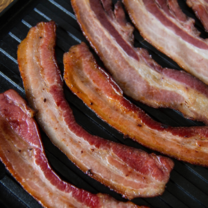 Bacon strips on a griddle